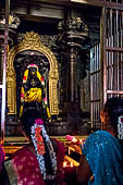 Worship and puja offerings inside the Swamimalai temple.